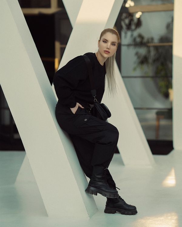 woman in olive cargo pants and chunky black lace-up boots