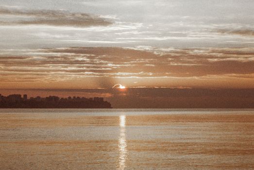 A captivating sunset view over a calm lake, highlighting peaceful nature and serene sky reflections.