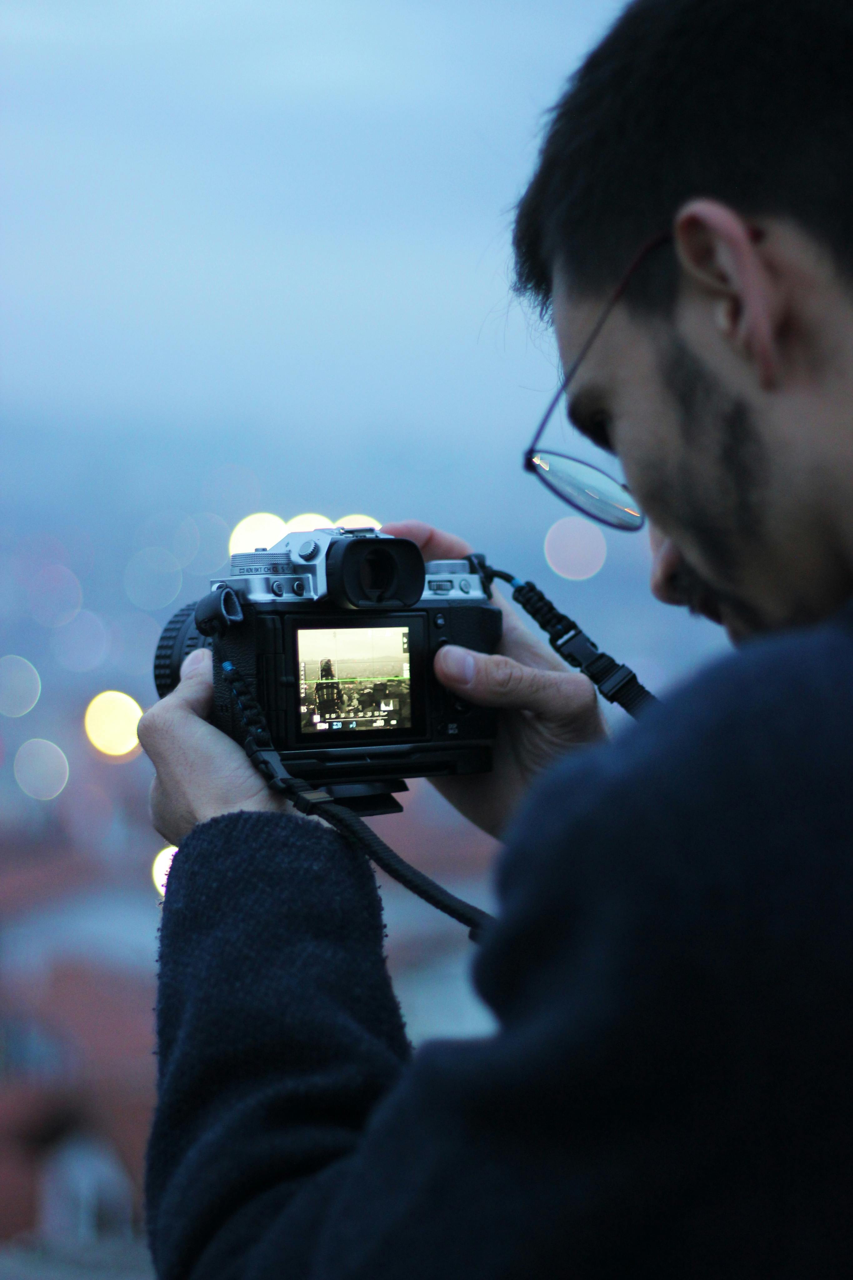 man photographing the city