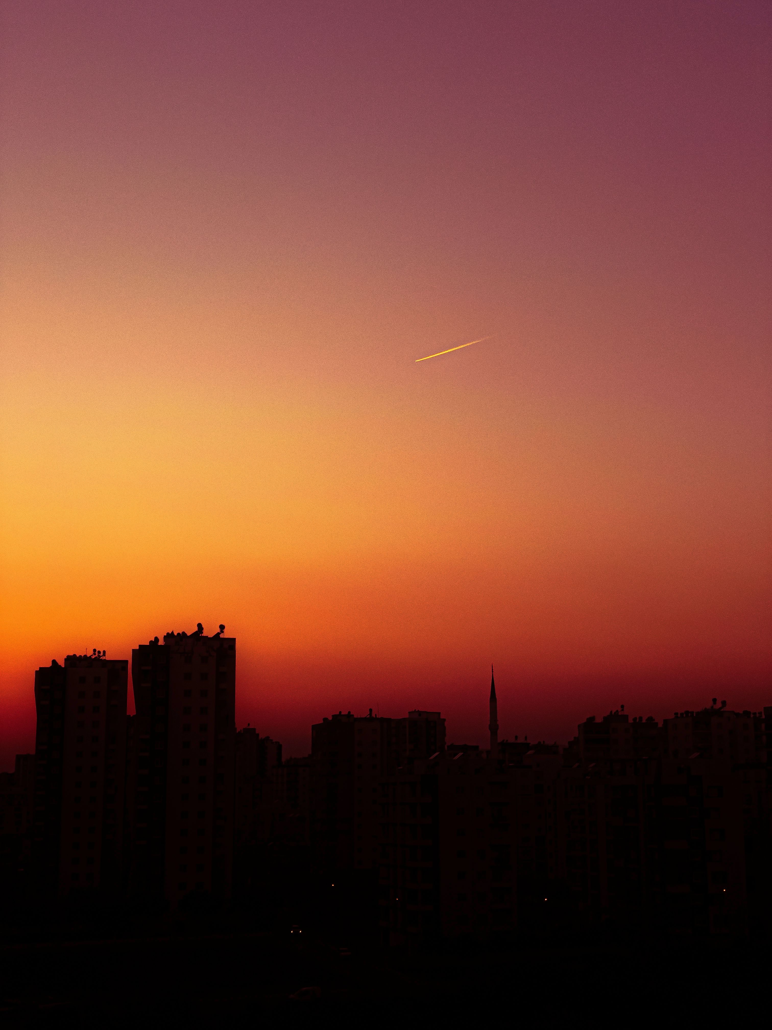 City Buildings Silhouettes Against Sunset Sky · Free Stock Photo