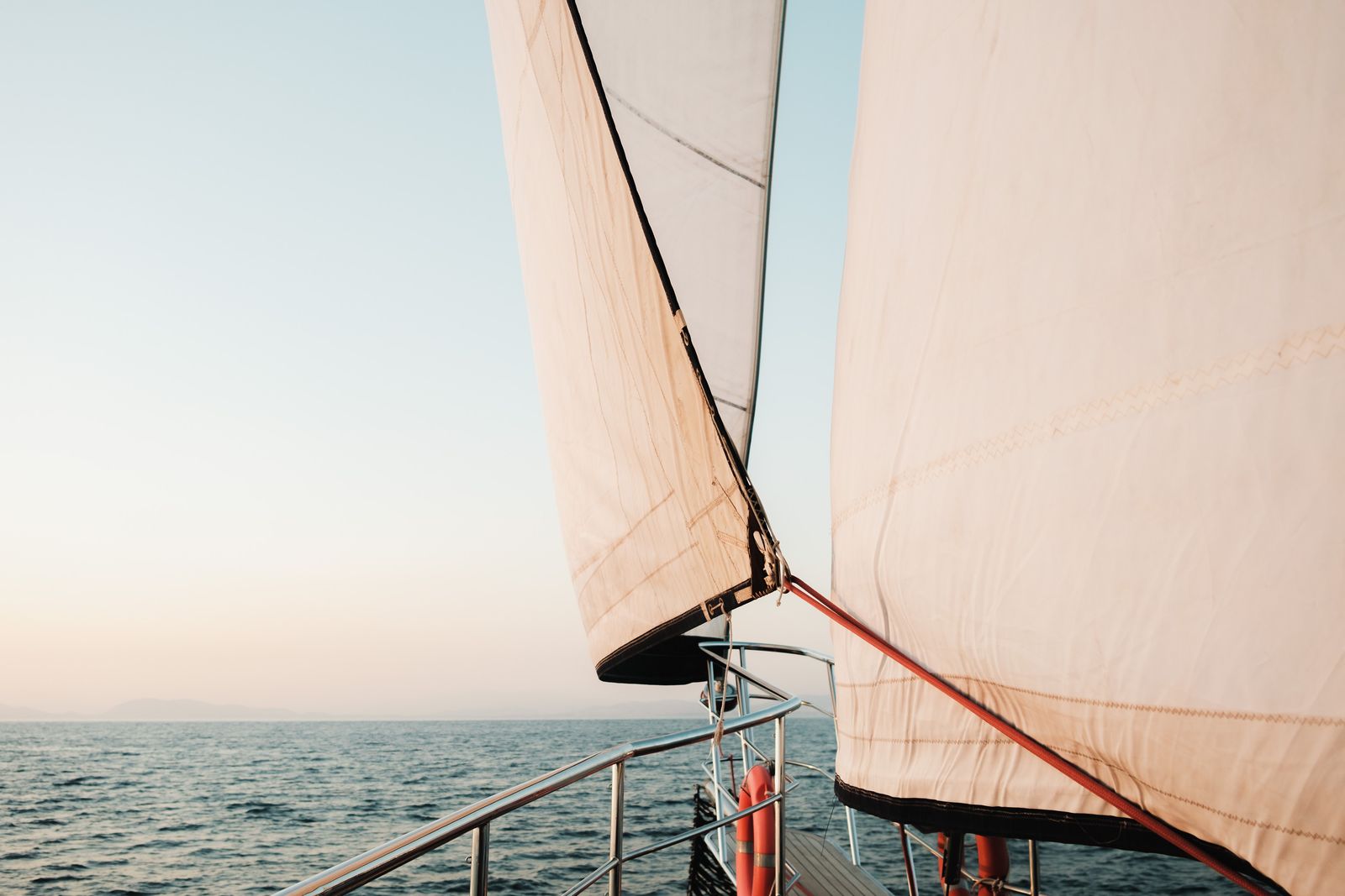 White sails over the open sea
