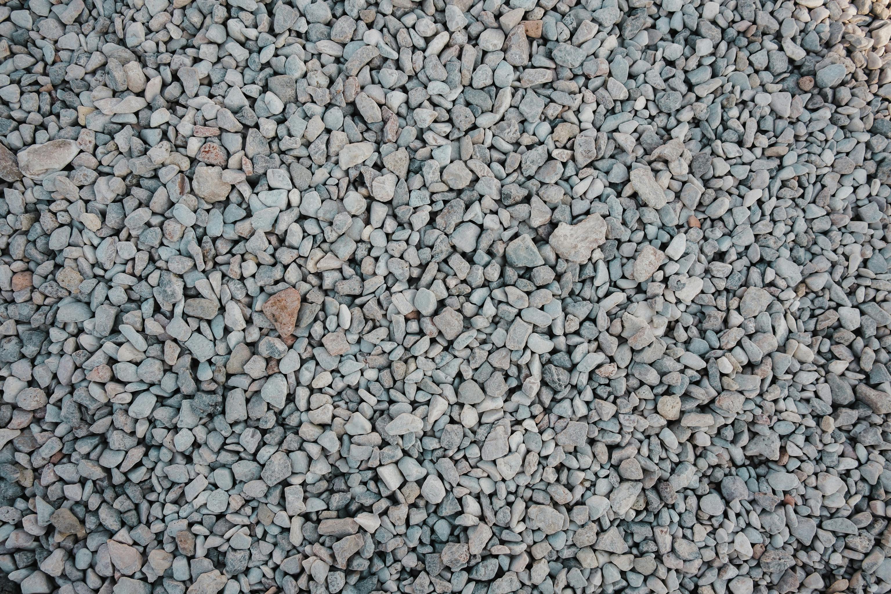 Compacted gravel base for stone patio installation - stone patio contractors near me