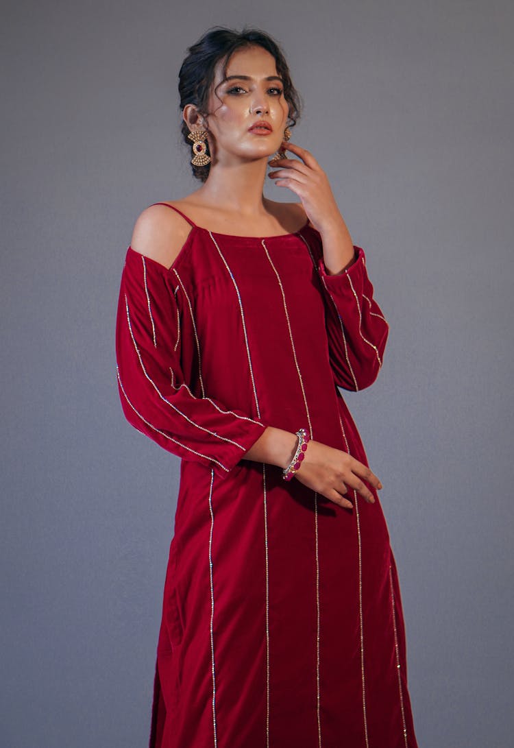 A Woman In Red Long Sleeve Dress