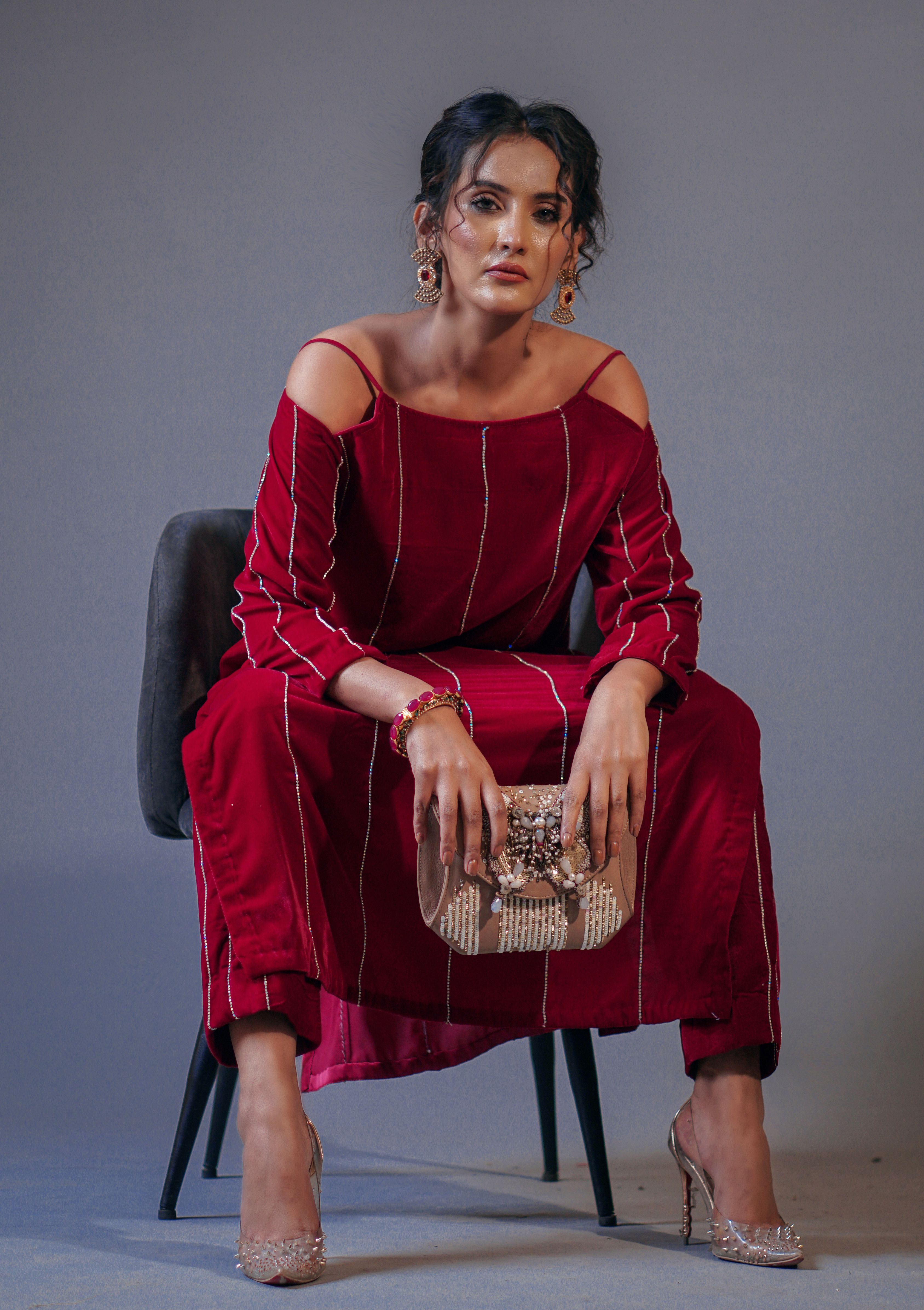 A Woman in Red Dress Sitting on Black Chair · Free Stock Photo