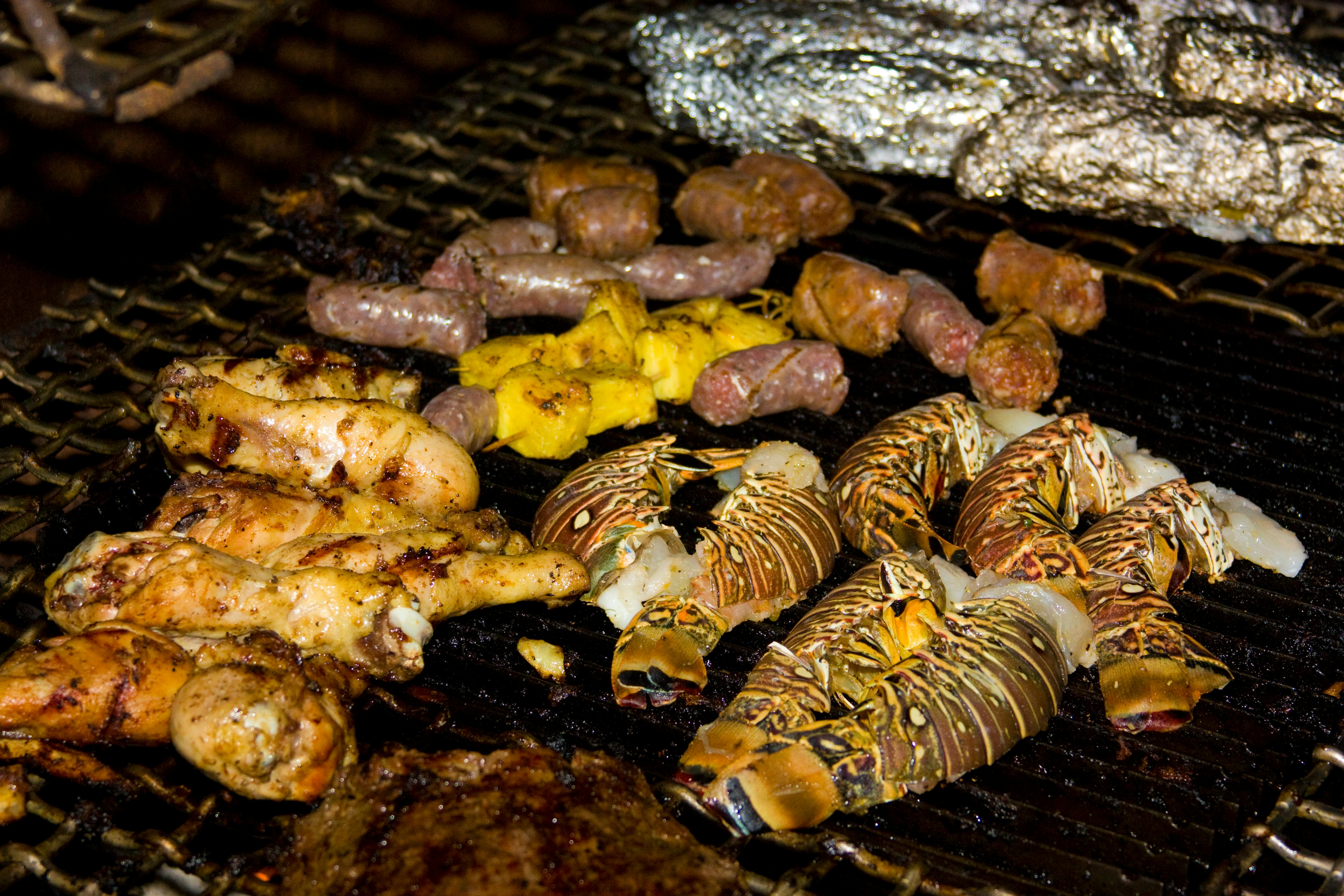 Free stock photo of grilled chicken legs, lobster, pineapple