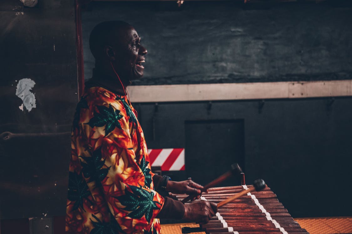 Man Playing Percussion Instrument