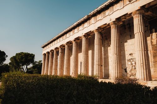 Free Sunny view of the ancient Temple of Hephaestus in Athens, Greece, highlighting its historic architecture. Stock Photo