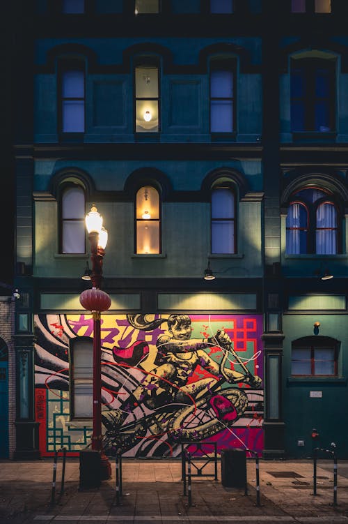 Mural on Building Facade at Night