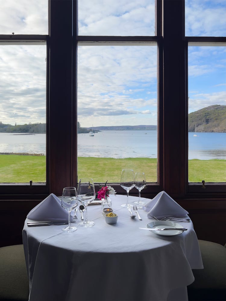 Table Setting Beside Glass Window With Sea View