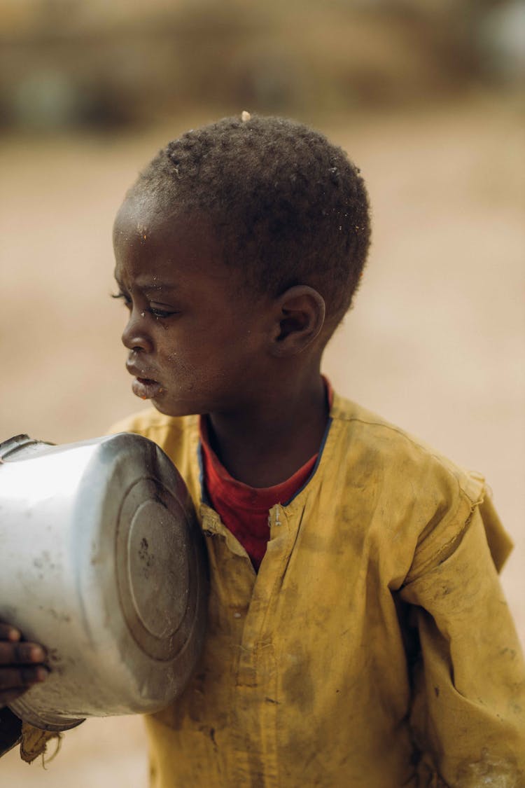 Boy Holding Pot