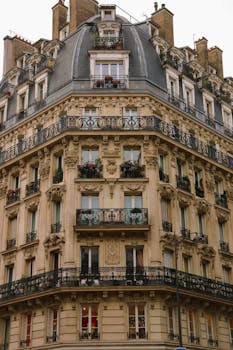 Charming Haussmann-style building facade in Paris, capturing classic European architecture.