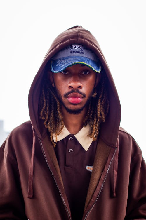 Portrait of a Man Wearing Brown Hoodie Jacket