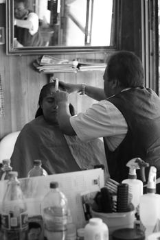 Capturing the essence of a barbershop in a timeless black and white setting.