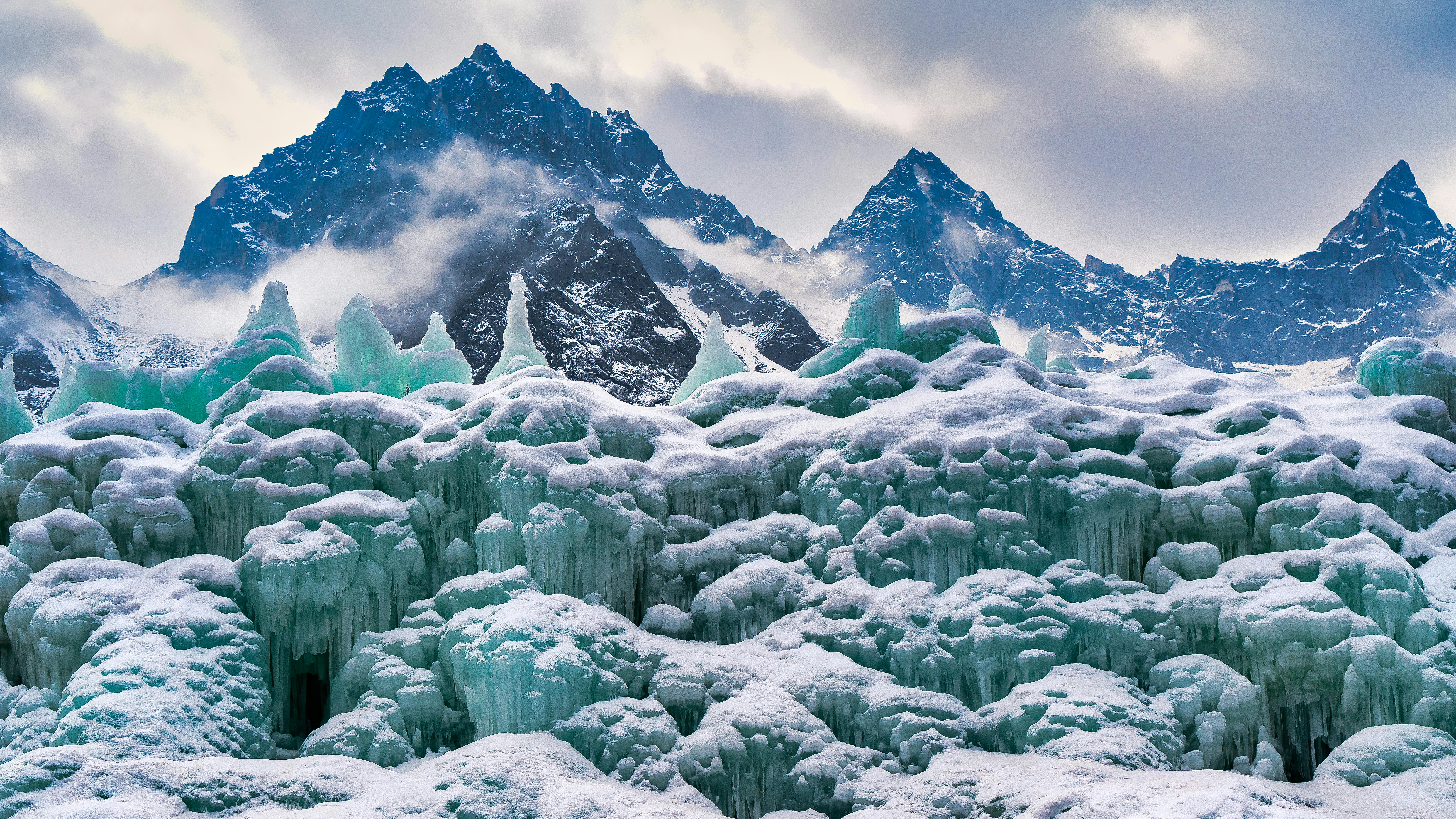 Icicles and a Mountain Range in Snow · Free Stock Photo