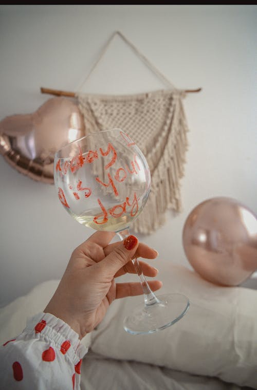 Woman Holding Glass with Text