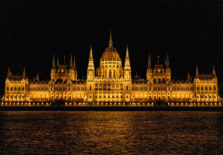 Illuminated Facade Of The Hungarian Parliament Building