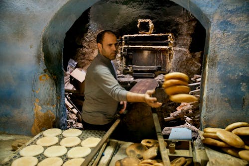 A Man Baking Bread Traditionally