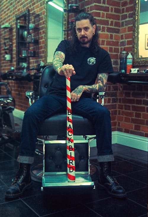 Man sitting in barbershop chair