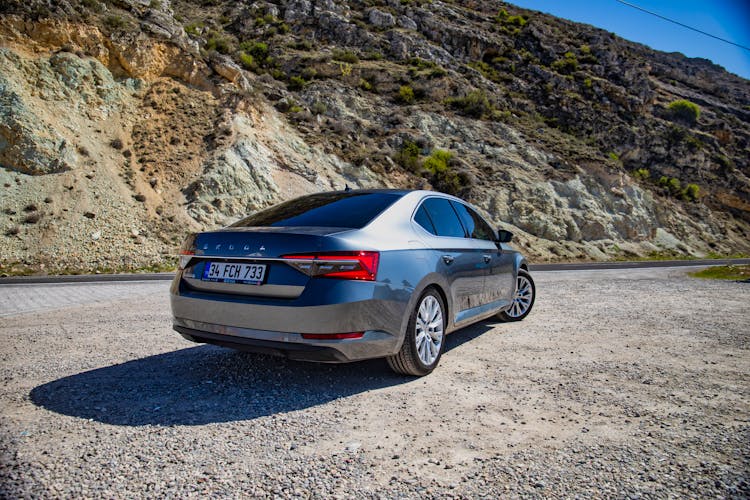 Skoda Superb On The Road In Mountains 