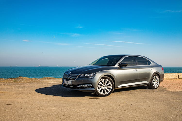 Skoda Superb Parked On The Shore