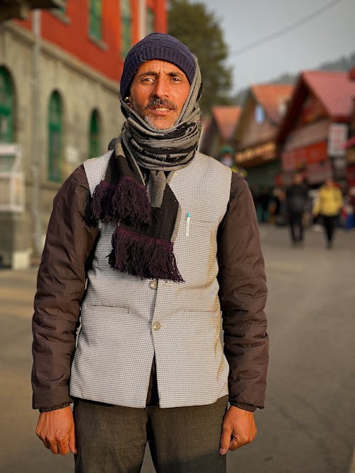 Portrait of Man in Vest and with Scarf and Hat