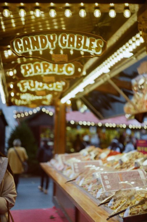 Free Colorful market scene in London with candy and lights attracting locals and tourists. Stock Photo