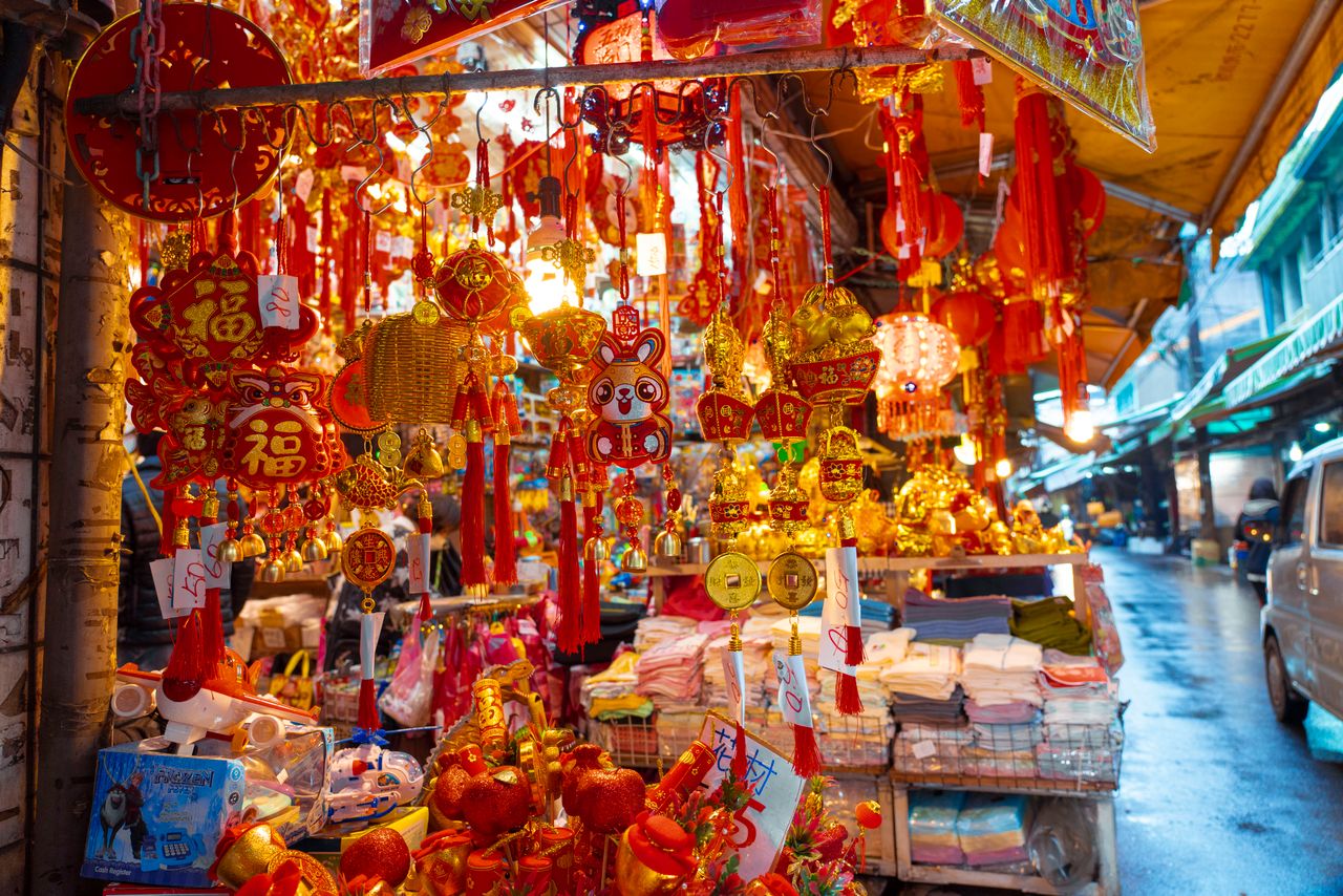 vibrant market stall filled with asian cultural decorations glowing in