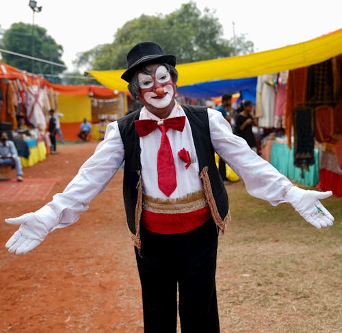 Clown Wearing a Black Hat