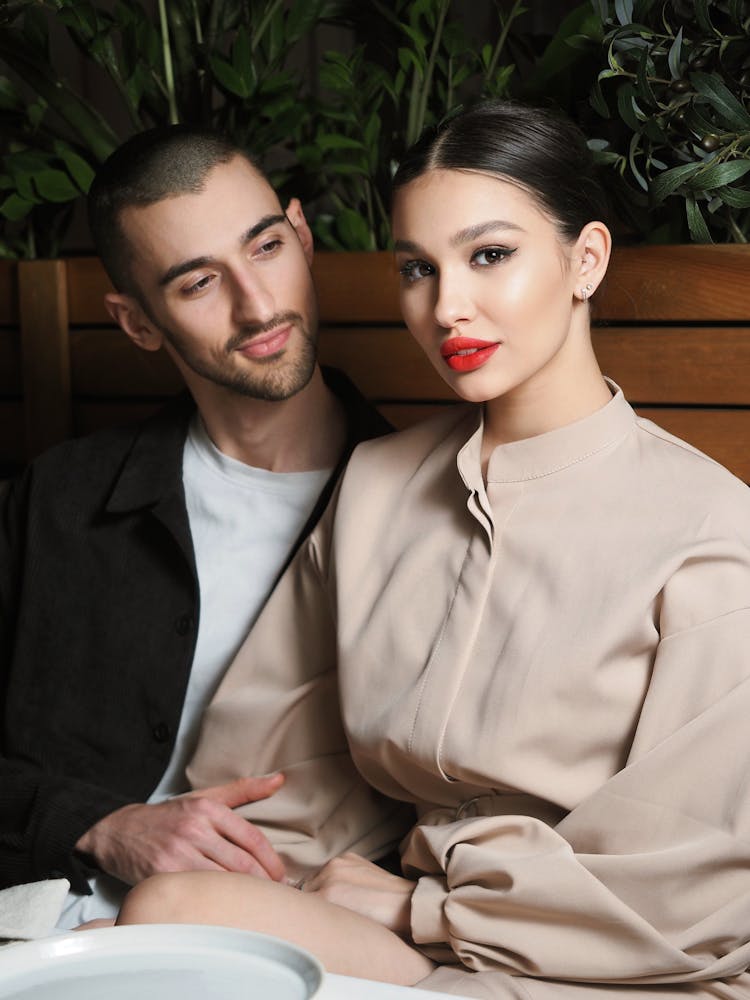 Couple Sitting By Table Together