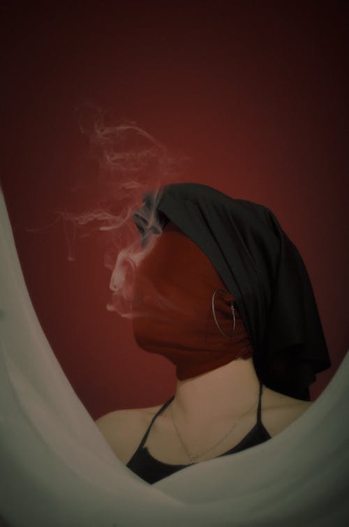 Woman with a Wrapped Head Smoking a Cigarette