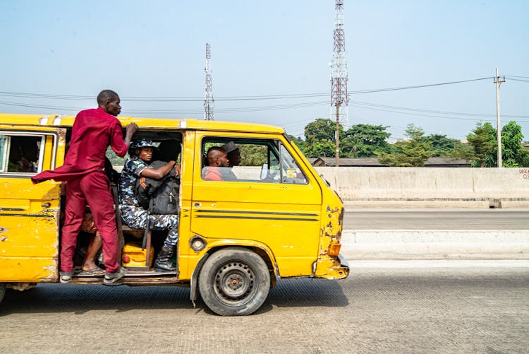 Men And Woman Driving Vintage Van