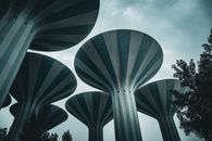 Modern water towers set against a moody sky in Kuwait City, showcasing unique architecture.
