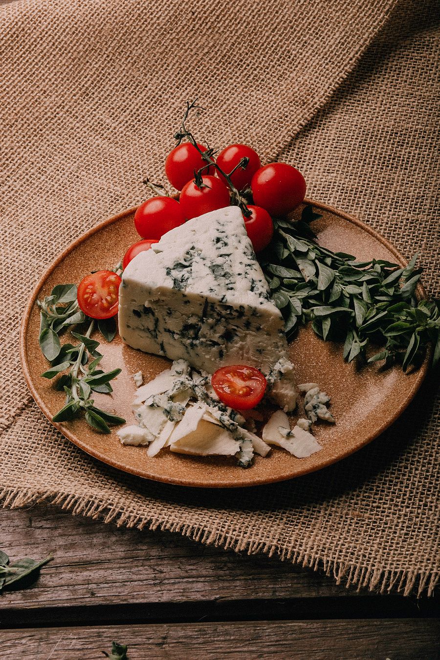 A wedge of blue-veined cheese