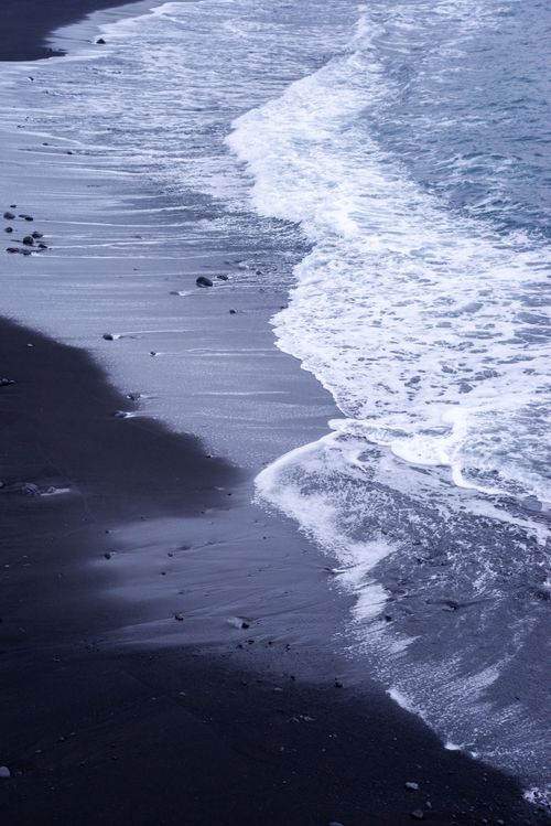 Free Stunning view of waves on a black sand beach in Puerto de la Cruz, Spain. Stock Photo