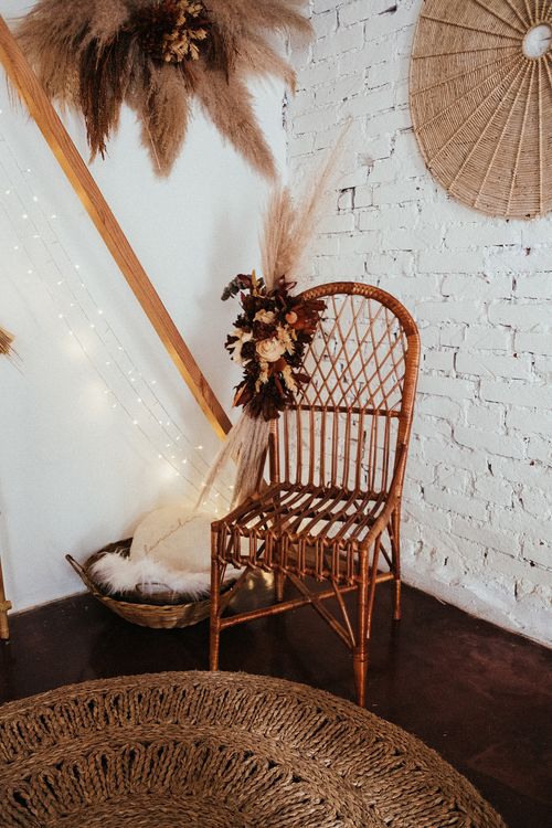 Free Cozy bohemian living room featuring a wicker chair and rustic decor elements. Stock Photo