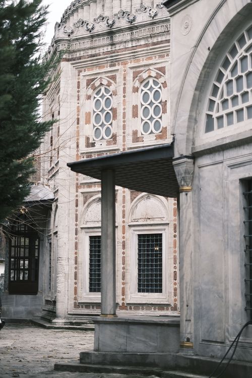 Free Detailed view of classic Ottoman architecture with intricate patterns and windows. Stock Photo