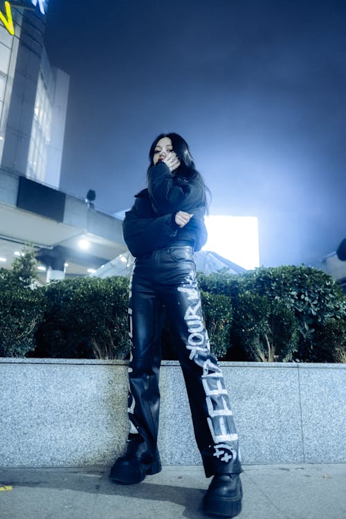 Woman in Leather Pants and Platform Shoes