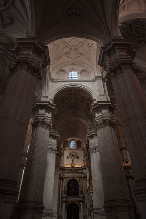 Free Majestic cathedral interior featuring towering columns and intricate architectural details. Stock Photo