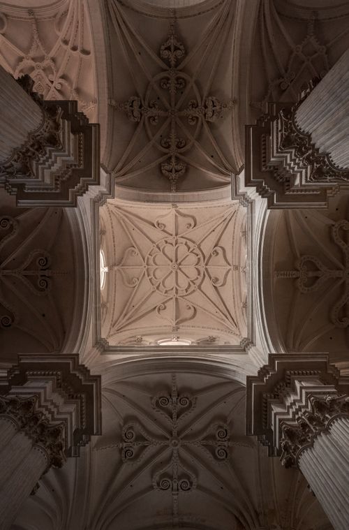 Free Intricate architectural design of a cathedral ceiling featuring decorated patterns and arches. Stock Photo