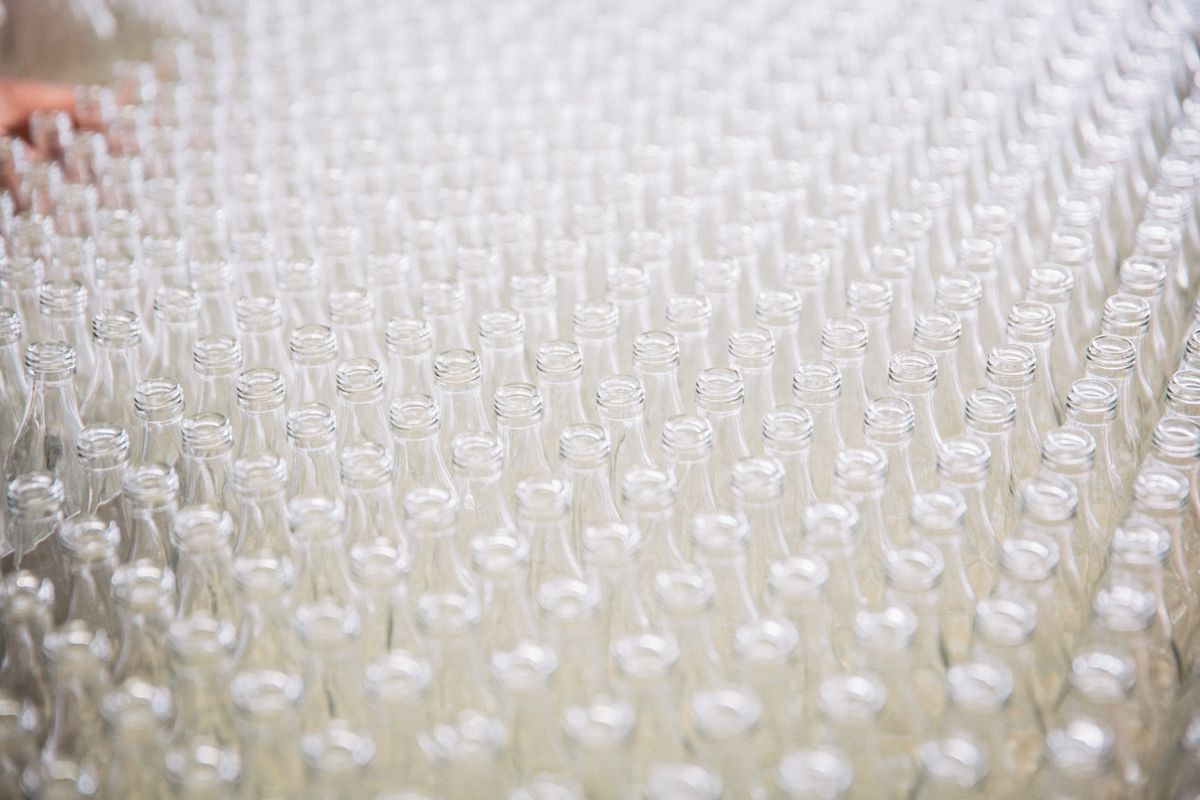 Rows of transparent cosmetic bottles used as a licensable beauty packaging visual