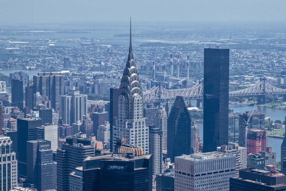 The Manhattan Helicopter Tour of New York - Stunning aerial view of New York City skyline showcasing the iconic Chrysler Building among other skyscrapers.