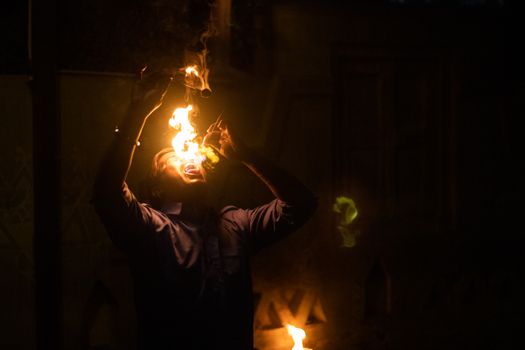 Fire-Eater Performing at Night