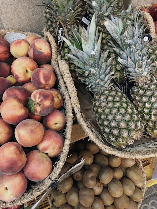 Close-up of Pineapples, Peaches and Kiwis