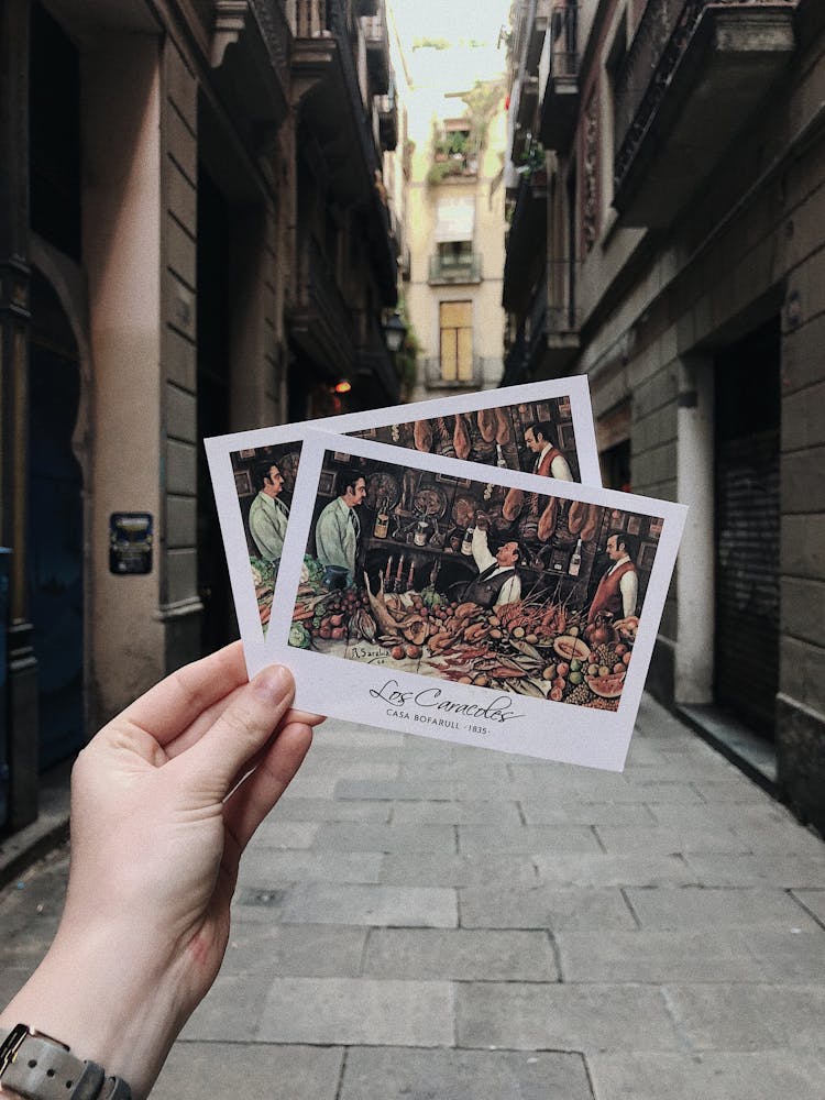 Photo Of A Person Holding Postcards