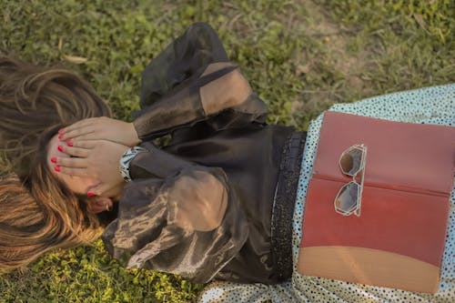 Overhead Shot of a Woman Hiding Her Face