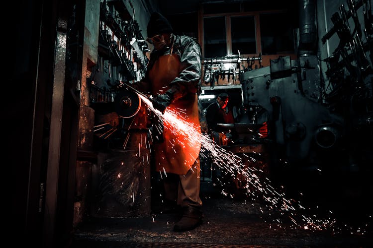 A Person Working In A Industrial Shop