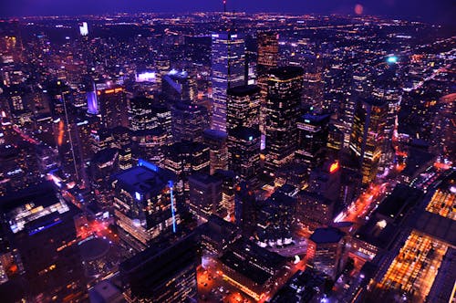 Aerial View of Illuminated Skyscrapers in City at Night