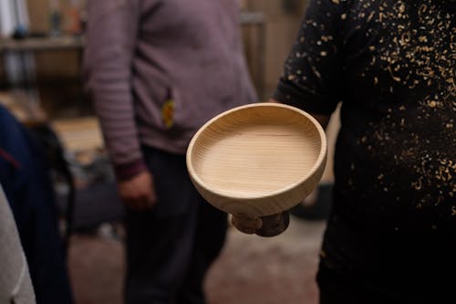 Woman Holding a Wooden Bowl 