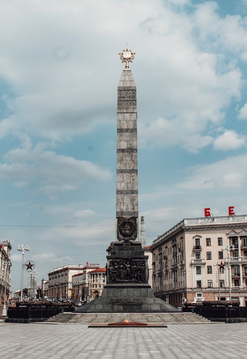 Free The iconic Victory Monument in Minsk, Belarus, stands tall against a bright blue sky, symbolizing peace. Stock Photo