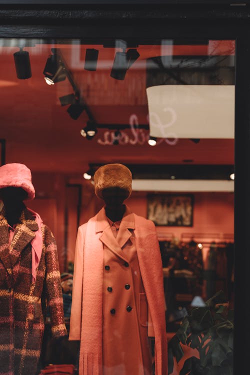 A Mannequin Wearing a Wig and a Plaid Coat · Free Stock Photo